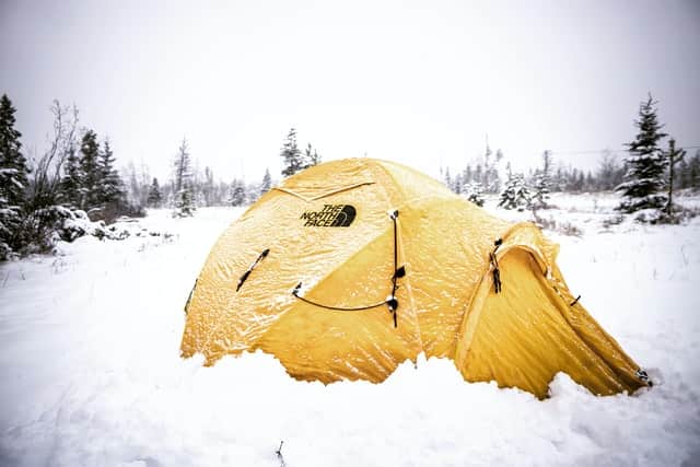 Yellow dome tent in snow