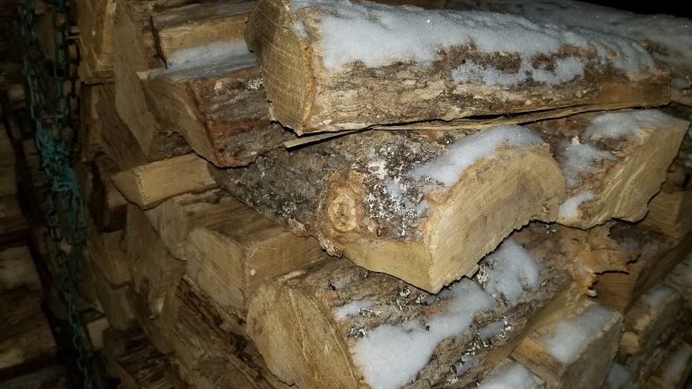 Close up of hardwoods firewood piled.