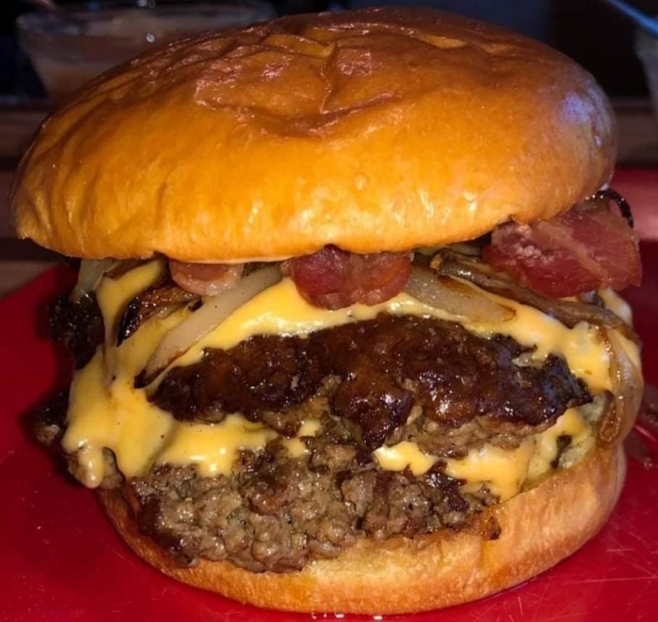 Double cheese hamburger with onions and bacon
