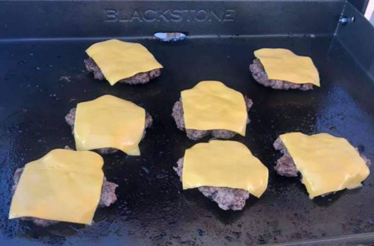 cheese over smash burgers on the griddle