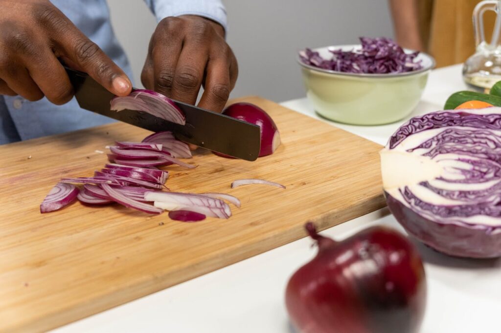 Chopping red onions on a cutting board